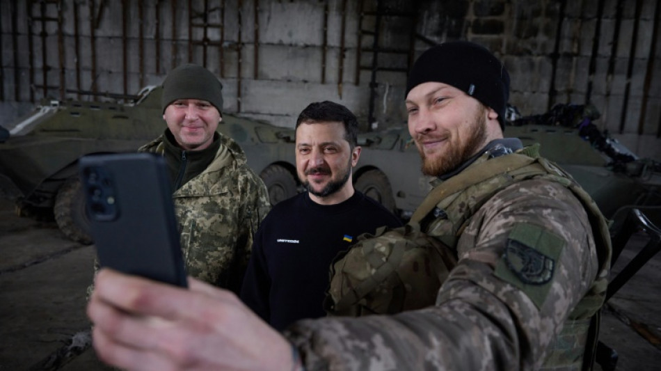 Zelensky visits frontline, deadly Russian strikes hit school, homes