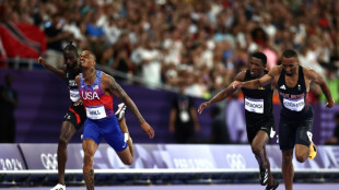 Quincy Hall lunges to win Olympic 400m title