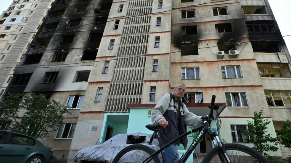 In a bombed-out building, Ukraine investigators take stock