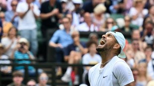 Well-behaved Kyrgios reaches second Wimbledon quarter-final