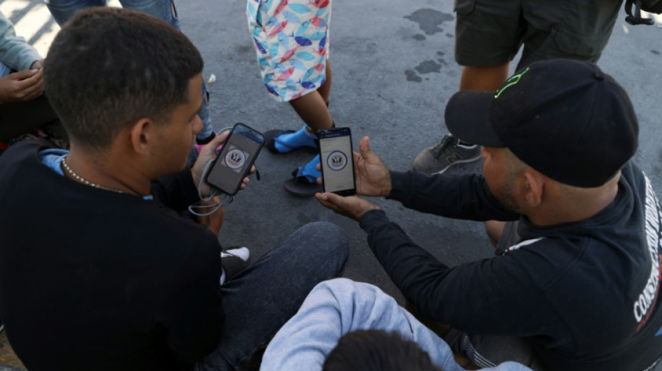 'A game of chance': Migrants battle glitchy app at US border