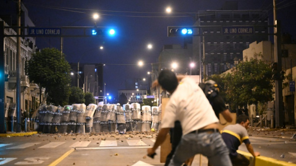 Clashes, fire in Lima as thousands rally against Peru government