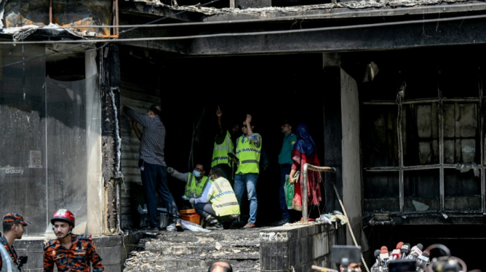 Grieving families await bodies after Bangladesh fire