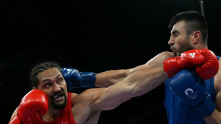 Reigning champ Jalolov 'runs like a cat' to reach Olympic semis