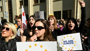 Georgians rally even as parliament scraps 'foreign agent' bill