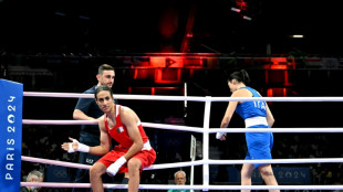 Algeria boxer in Olympic gender row wins in 46 seconds as Italian PM hits out