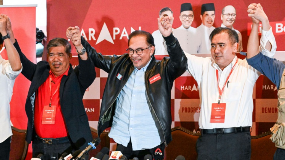 Malaysia's Anwar claims majority after vote, but rival does not concede