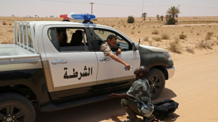 Libya border guards rescue migrants in desert near Tunisia