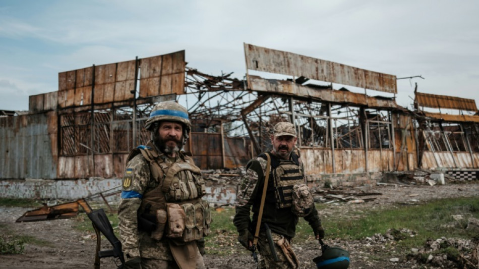 Civilians lie slain as Russian troops flee Ukraine push