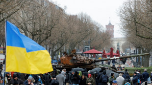 Tank wreck, protests mark Ukraine war anniversary in Europe