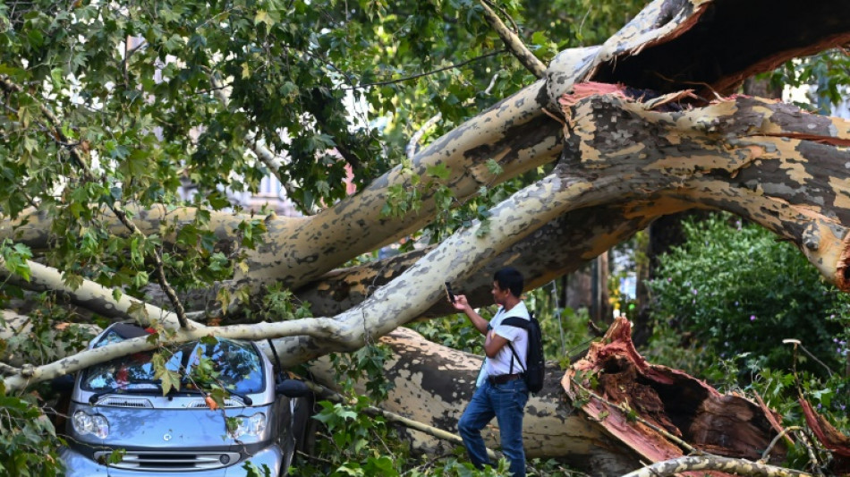 Two dead in storms in northern Italy as Sicily fires close airport