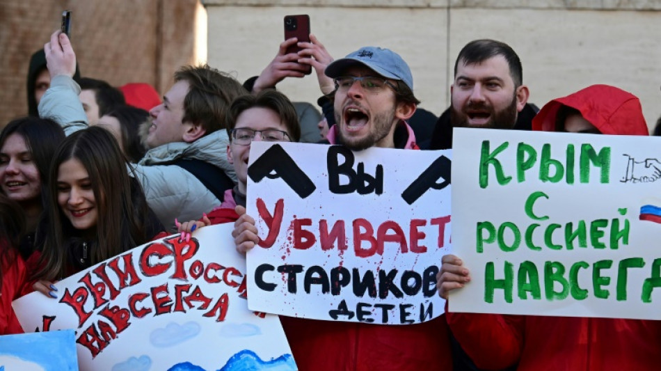 Pro-Kremlin activists rally outside embassies on Crimea anniversary