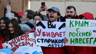 Pro-Kremlin activists rally outside embassies on Crimea anniversary