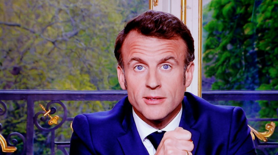 Macron seen singing in the streets after pensions address