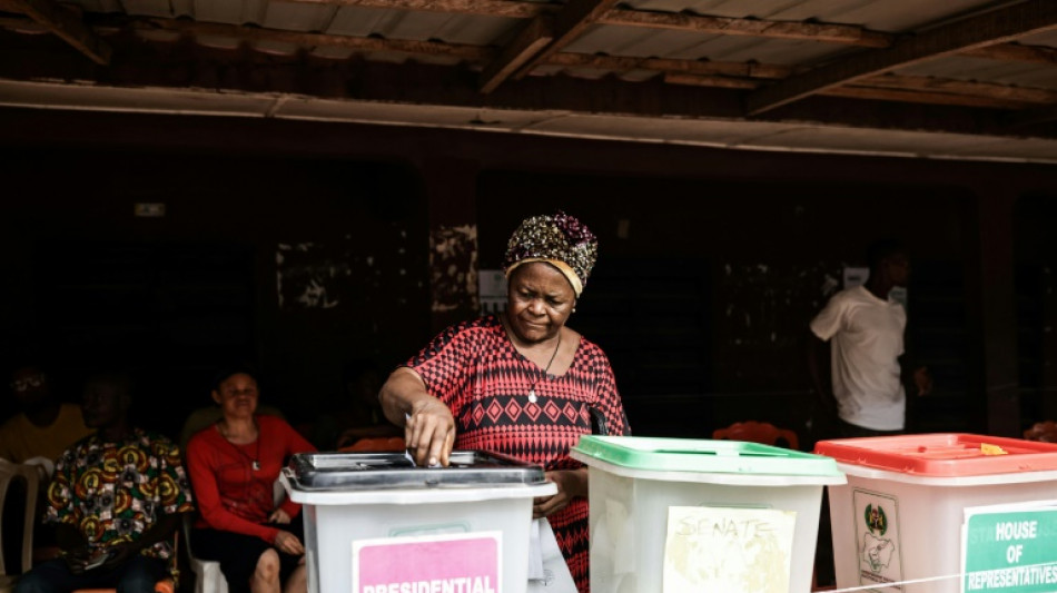 Nigerians vote for new president in tight election race