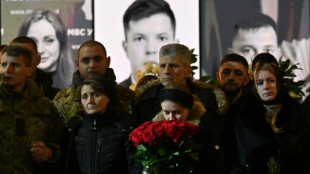 'Not broken by war': Ukraine holds funeral for minister killed in crash