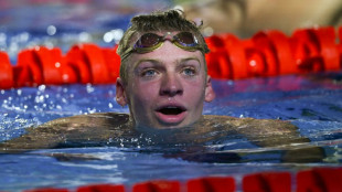 Marchand scorches to medley world title in pursuit of Phelps