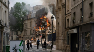 Rescuers comb through rubble of Paris building blast