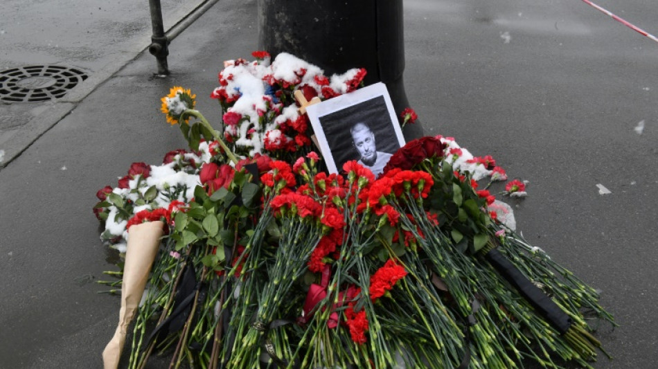 Russia arrests young woman over death of top military blogger