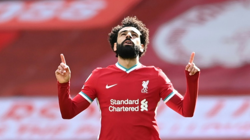 Salah ends speculation by signing new Liverpool contract