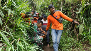 Indonesian rescuers race to find 10 missing after eruption