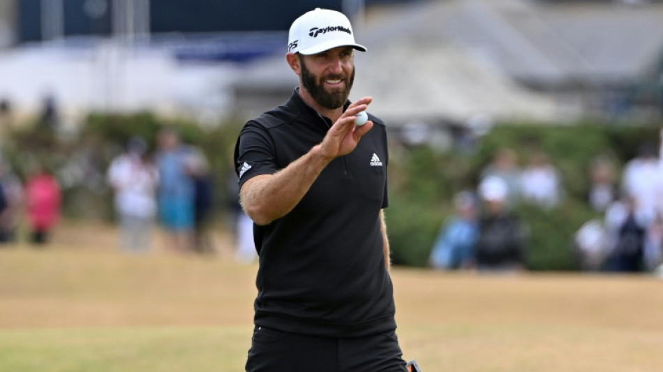 Dustin Johnson takes British Open lead as emotional Woods bows out