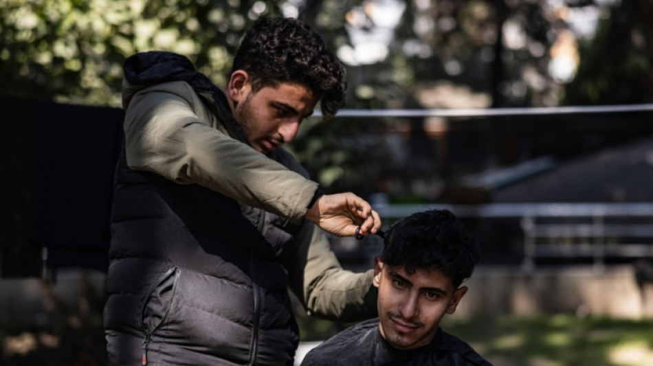 Barber tidies up in Turkey quake tent camp