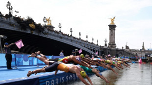 Triathletes dive into Seine, as Biles seeks to extend Olympic gold rush