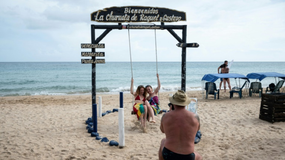 Shunned over war, Russians holiday on Venezuelan resort island