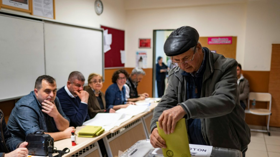 'We want peace': Divided Turks vote in tense election