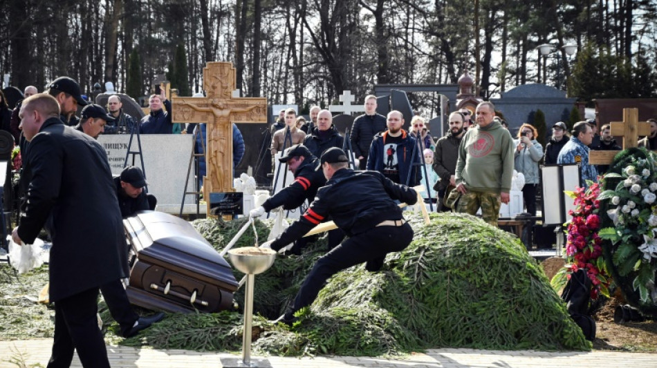 Hundreds turn out for funeral of Russian military blogger