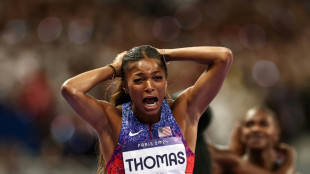 Thomas takes Olympic 200m, Hocker streaks to shock 1500m victory