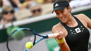 Muguruza gets much-needed win in Eastbourne