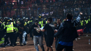 'Fans died in players' arms,' says coach at Indonesia football tragedy