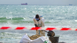 Spain cleans up after mystery substance closes three beaches