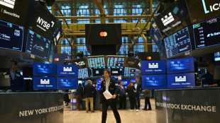 Wall Street termine en hausse, record du Dow Jones