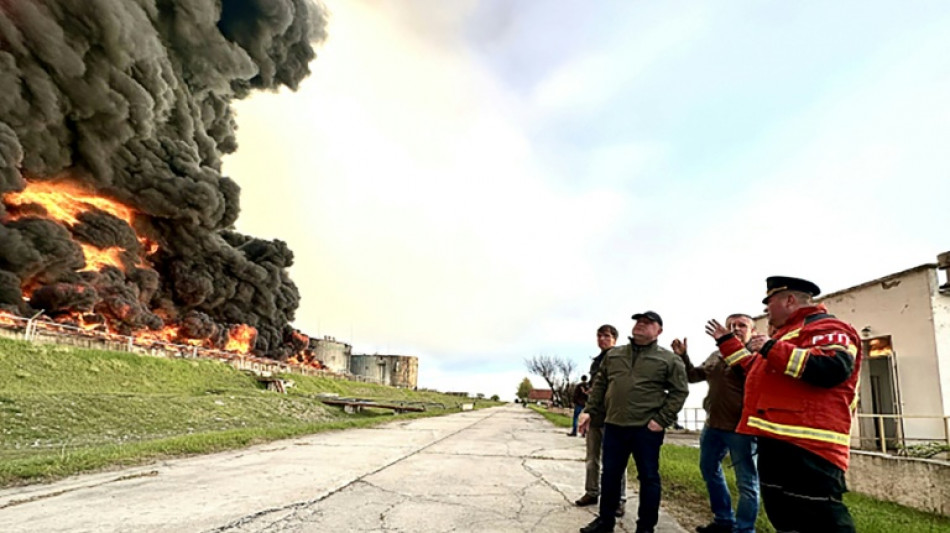 Crimea fuel depot on fire, Russian-held towns shelled in Ukraine