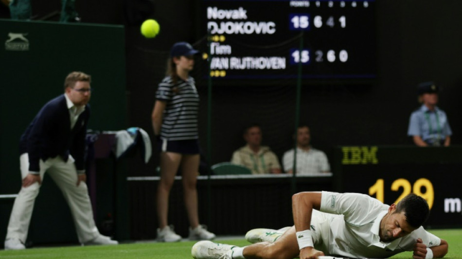 Djokovic into 13th Wimbledon quarter-final despite blip