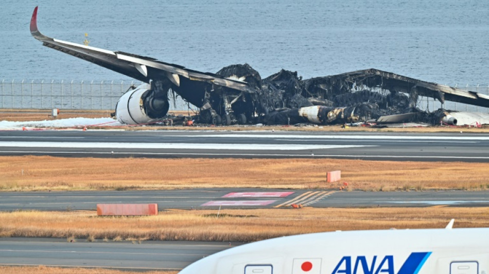 Japan probes plane inferno after 'miracle' escape