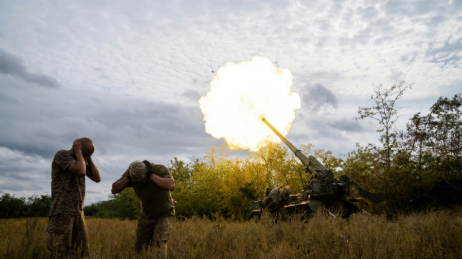 Ukraine reveals discovery of mass grave as US announces new aid