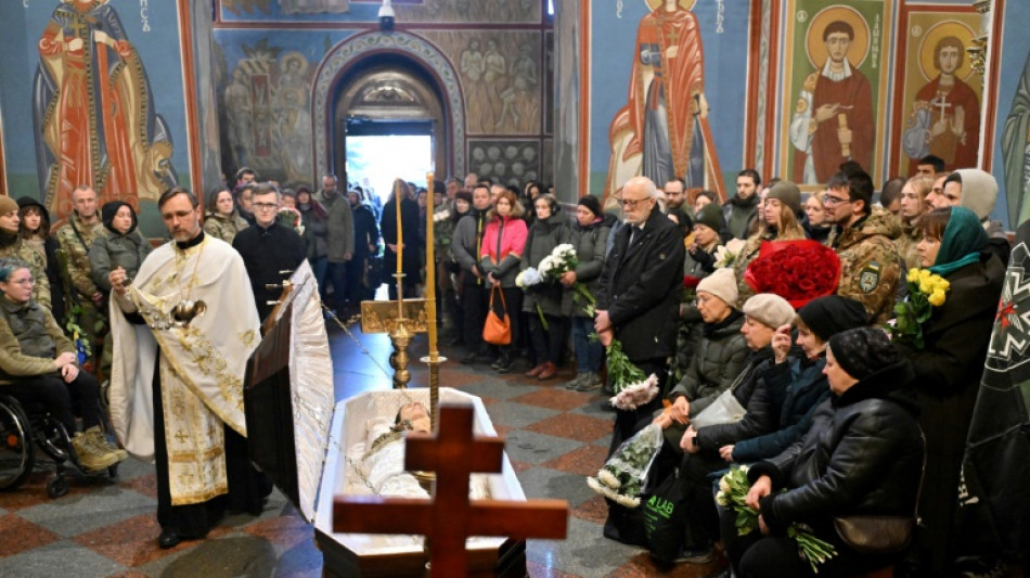 Mourners bid farewell to medic killed in east Ukraine 