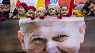 Demonstrators in Poland defend late pope John Paul II