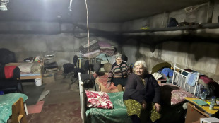 Ukraine shelter residents mark each day alive with a red cross