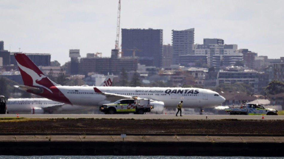 Qantas plane returns to Australia airport due to 'engine failure', sparks fire