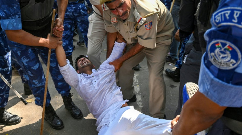 India's parliament adjourned after protests over Gandhi expulsion