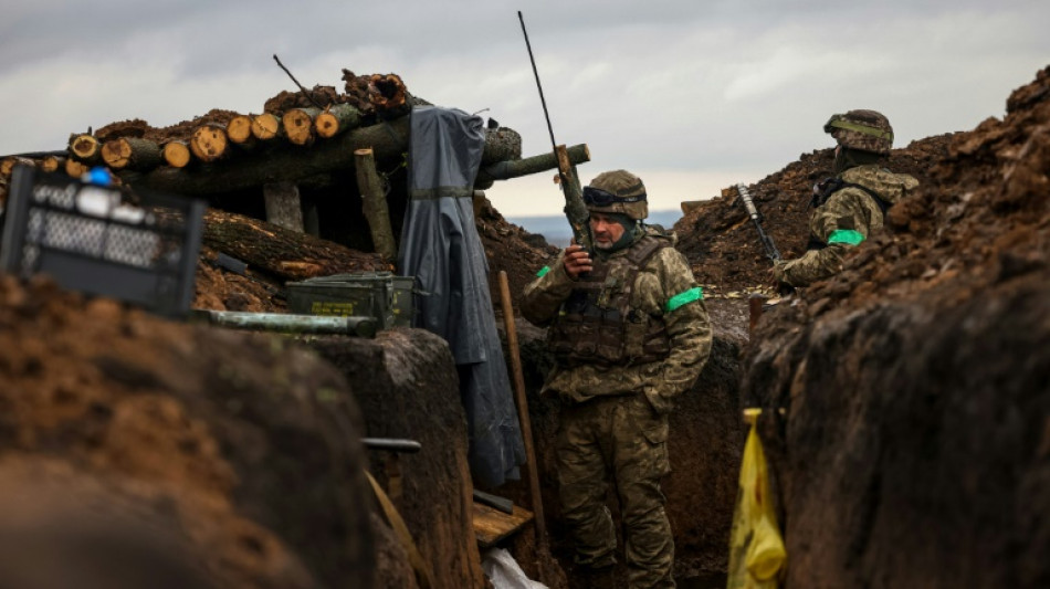 In east Ukraine, holding the line, waiting to attack