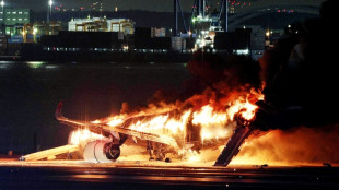 Japan Airlines plane on fire on runway at Tokyo's Haneda airport: TV images