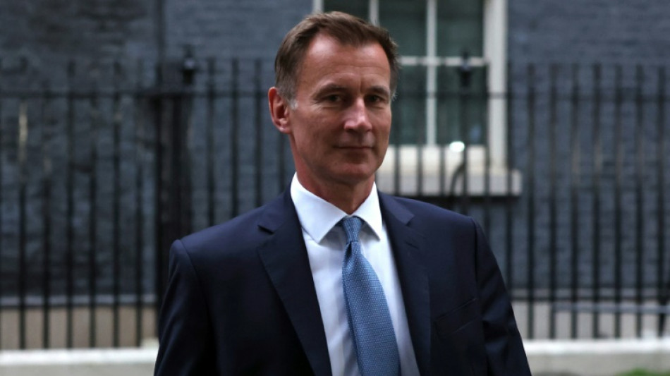 UK's new finance minister admits taxes to rise as PM reels