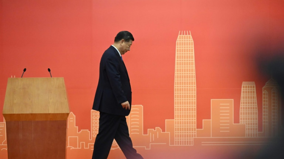 China's Xi presides over muted Hong Kong handover anniversary